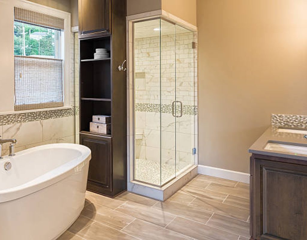 Bathroom remodeling crew installing new shower system with precision