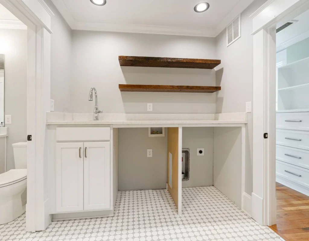 Updated powder room featuring coordinated flooring, wall finishes, hardware, and fixtures in Western Springs, IL. Powder room remodel near me